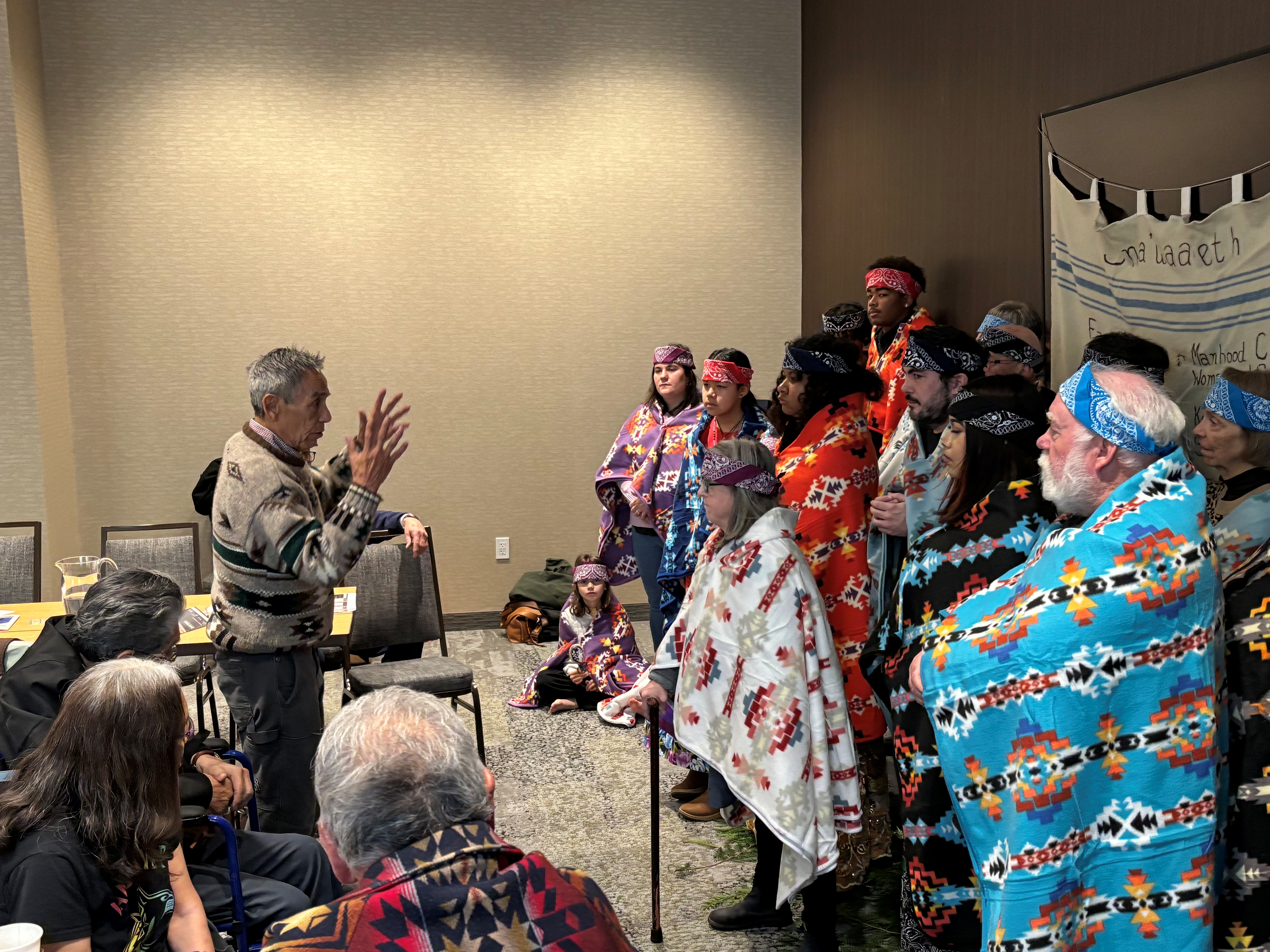 Ken George of Cowichan Tribes and Joe speaking to participants of a blanketing ceremony